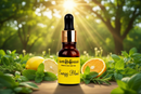Bottle of Earth Essentials Energy Blend in a natural setting with greenery.