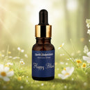 Bottle of 'Happy Blend' from earthEssentials with a natural background of flowers and greenery