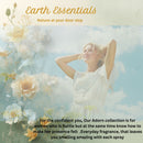 Woman in a white dress surrounded by flowers with 'Earth Essentials' branding.