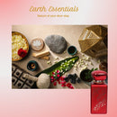 Red bottle with decorative elements on a pink background, featuring 'Earth Essentials' branding.